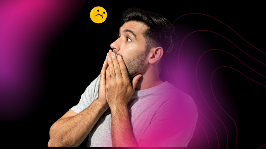 Homem com a mão no rosto e um emoji triste